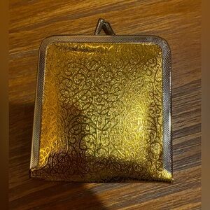 VNTG kiss lock makeup mirror gold foil design and a kiss-lock closure 1960’s